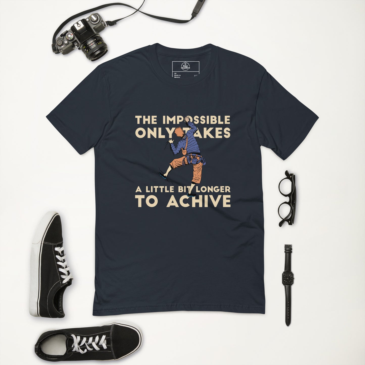 Men's fitted midnight navy t-shirt featuring "Achieve the Impossible" rock climbing design by Knot Qualified.