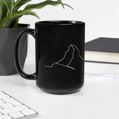 Black glossy minimalist mug with line art design, featuring a handle on the left, by Knot Qualified.