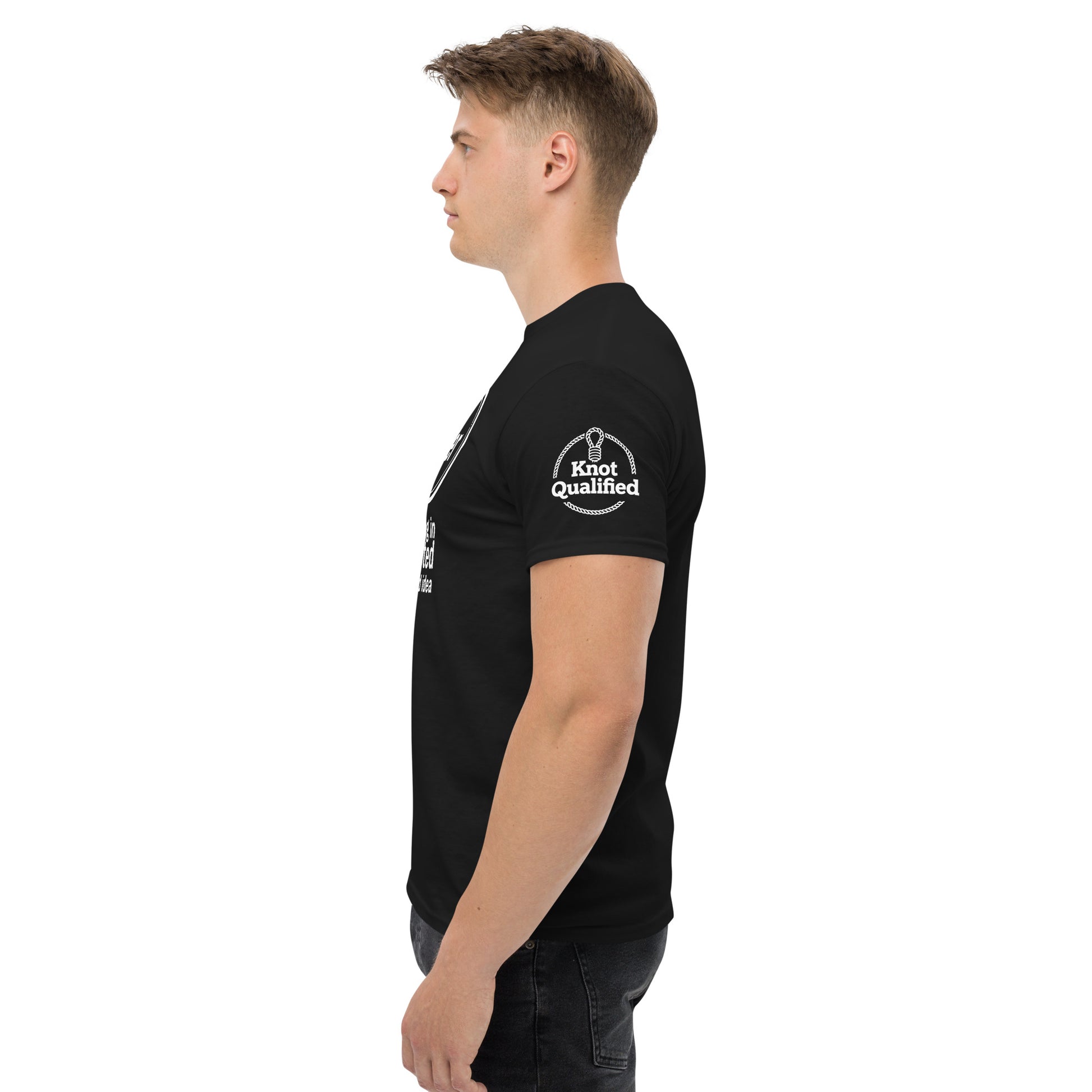Unisex black T-shirt by Knot Qualified featuring "MeatRoller" graphic on the front, displayed from the left side.