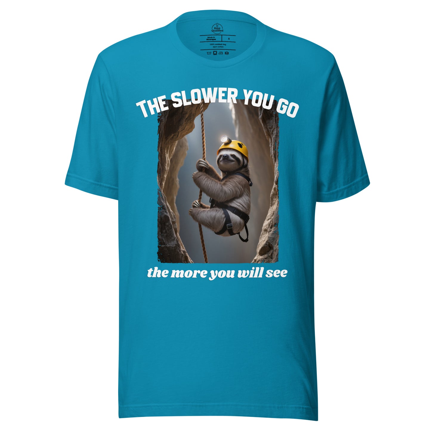 Aqua unisex t-shirt from Knot Qualified featuring the phrase "The slower you go - the more you will see" on the front.