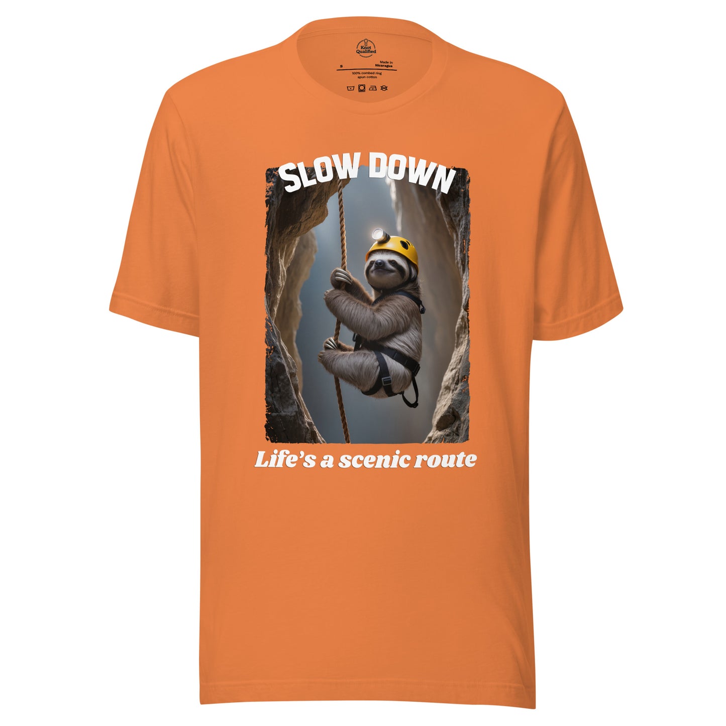 Unisex burnt orange T-shirt from Knot Qualified featuring "Slow down Life’s a scenic route" graphic on the front.