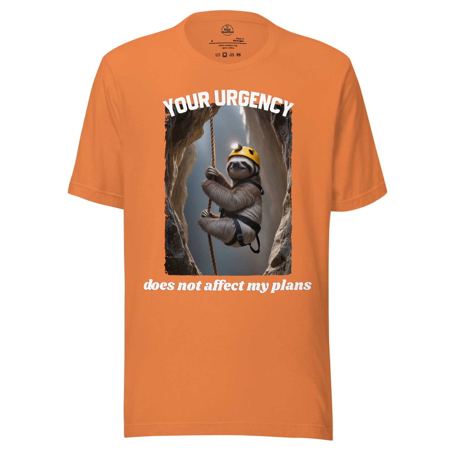 Burnt orange unisex t-shirt by Knot Qualified featuring the phrase "Your urgency does not affect my plans" on the front.